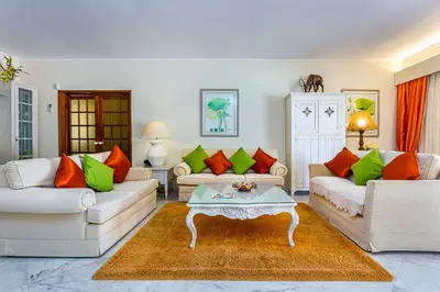 a living room with two couches and a coffee table at Albufeira Villa El-Gharb private 4 Bedrooms in Albufeira