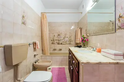a bathroom with a toilet and a sink at Albufeira Villa El-Gharb private 4 Bedrooms in Albufeira