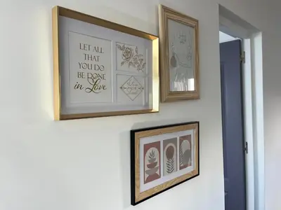 three framed pictures on a wall in a room at Ocean view by Charmes C in Albufeira
