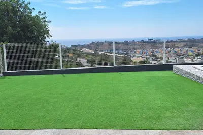 a field of green grass on a soccer field at Ocean view by Charmes D in Albufeira