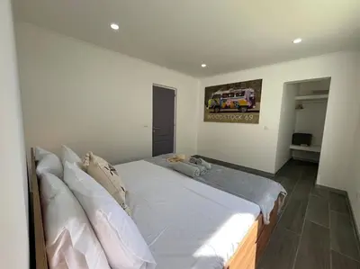 a bedroom with a large bed with white sheets at Ocean view by Charmes D in Albufeira