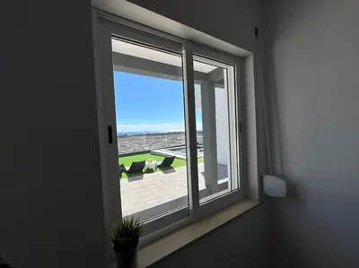 a window in a room with a view of a patio at Ocean view by Charmes D in Albufeira