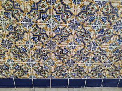 a blue and yellow tiles on a wall at Blife Antonya private rooms at 3rd floor in Faro