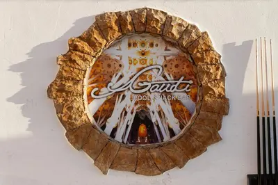 a mirror on a wall with a sign on it at Ourabay Hotel Apartamento - Art & Holidays in Albufeira