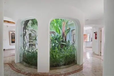 a hallway with two windows with plants in them at Casa Isabella in Vilamoura