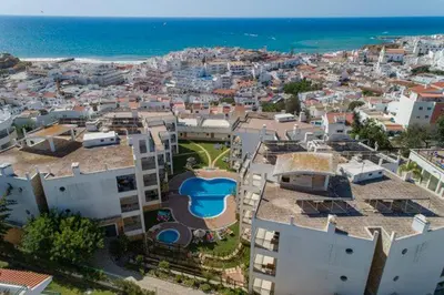 an aerial view of a city with buildings and the ocean at Colina do Atlântico 203 in Albufeira