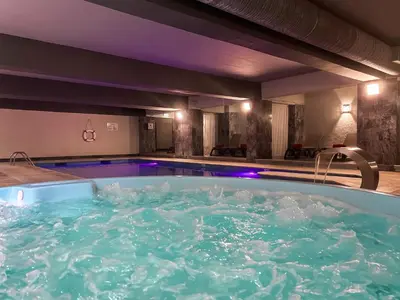 a swimming pool in front of a building at Luna Hotel da Oura in Albufeira