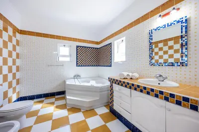 a bathroom with a toilet and a sink at Villa Lis in Galé