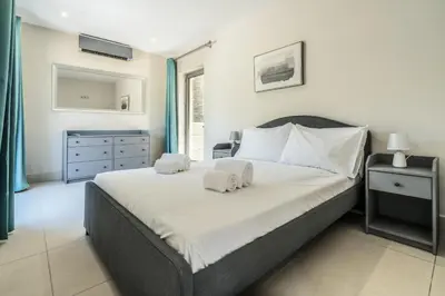 a bedroom with a large bed with two towels on it at Vilamoura Pine Hills with Pool by Homing in Vilamoura