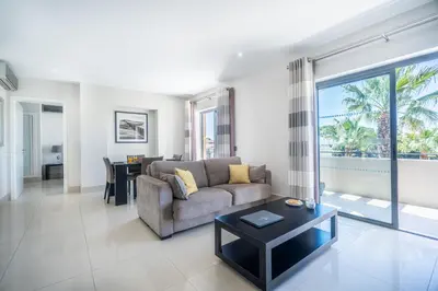 a living room with a couch and a table at Vilamoura Pine Hills with Pool by Homing in Vilamoura