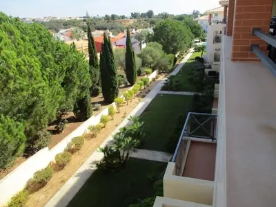 a view of a garden from a building at 2 bedroom top floor apartment in Albufeira in Albufeira