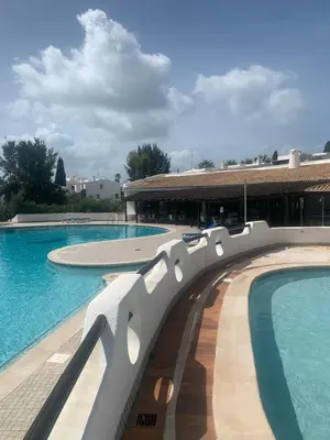 a view of two swimming pools in a building at Apartamento São Rafael Holidays in Albufeira