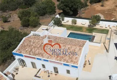 an aerial view of a house with a sign on the roof at Monte Gerações - Complete House - Heated pool - Typical Algarvian - close to Quinta Lago Vale Lobo and Vilamoura in Almancil