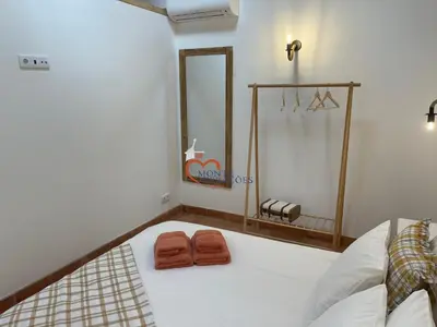 a bedroom with two brown towels on a bed at Monte Gerações - Complete House - Heated pool - Typical Algarvian - close to Quinta Lago Vale Lobo and Vilamoura in Almancil