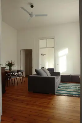 a living room with a couch and a table at Casas Adentro in Faro