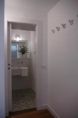 a bathroom with a sink and a mirror at Casas Adentro in Faro