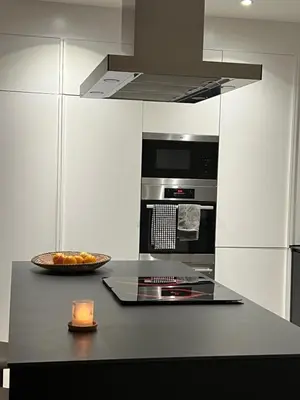 a kitchen with a counter with a bowl of fruit at villagoldra rentals - Luxury and Family Villa in Goldra de Baixo