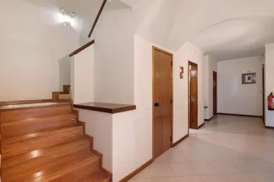 a hallway with stairs in a house at Bela Vista House T2 in Albufeira