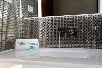 a bathroom with a sink with a faucet at Villa Pinheiro CD 84 - Cleverdetails in Vilamoura