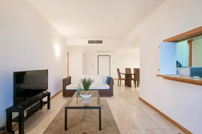 a bedroom with two beds and a window at Residence Golf Club lovely Ap in Quarteira