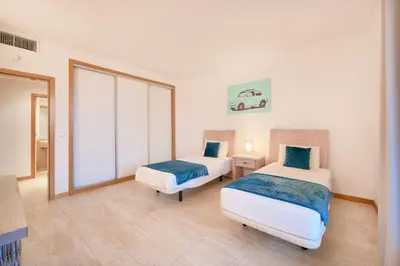 a living room with a couch and a table at Residence Golf Club lovely Ap in Quarteira