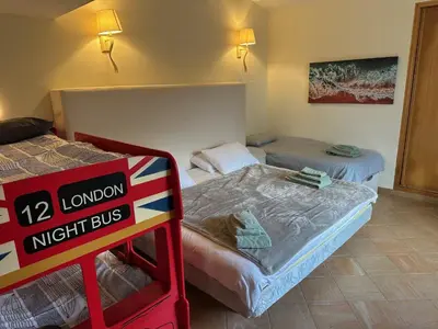 two beds in a room with a sign in front of it at Casa Tranquility with beautiful heated pool and Jacuzzi! in Loulé
