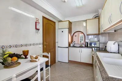a bedroom with a large bed with towels on it at Villa Martinique in Albufeira