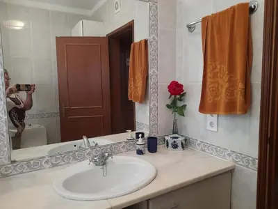 a bathroom sink with a mirror on a counter at Modern apartment in Vilamoura with shared pool in Vilamoura