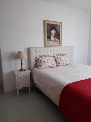 a living room with a couch and a table and a tv at Modern apartment in Vilamoura with shared pool in Vilamoura
