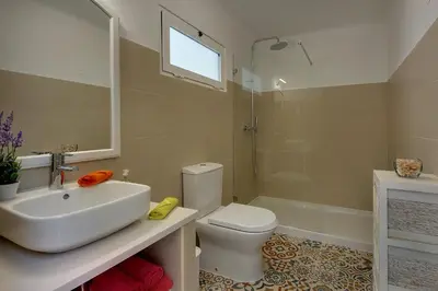 a bathroom with a sink and a toilet and a shower at Inn The Beach Apartments by Seareen in Albufeira