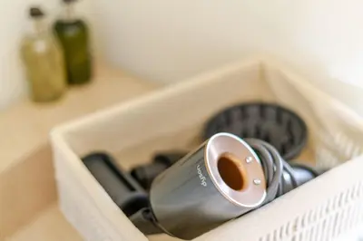 a container with a hairdryer in a drawer at Modern Sea View Villa, Heated Pool,Rooftop Jacuzzi Outdoor Kitchen 12min faro Airport in Santa Bárbara de Nexe