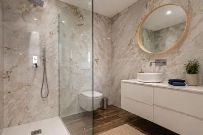 a bathroom with a tub and a sink at Villa MariVital I Luxury I Heated Pool I Old Town in Albufeira