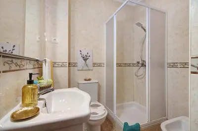 a bedroom with two beds and a window at Villa Martina in Albufeira