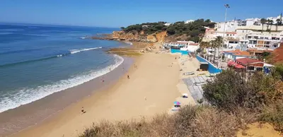a view of a beach with people and the ocean at Casa da Praia in Albufeira