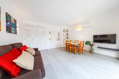a bathroom with a shower and a toilet and a sink at Apartment Portofino 2 by Algarve Vacation in Quarteira
