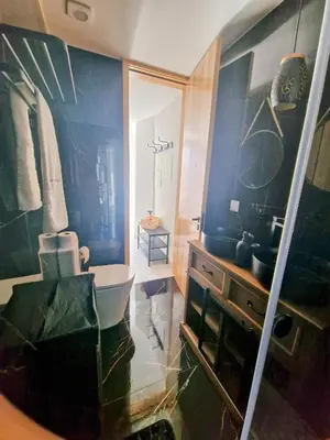a bathroom with a sink and a toilet in it at RECANTO da FELICIDADE in Albufeira