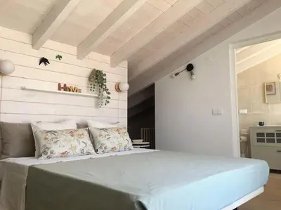 a bedroom with a large bed in a room at Casa Herdeiro in Faro