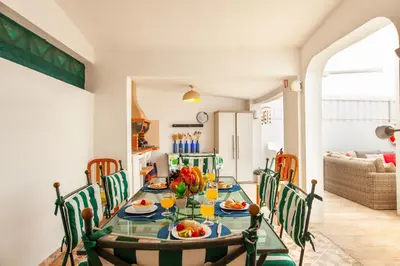 a dining room with a table and chairs at Villa Thai by Algarve Vacation in Albufeira