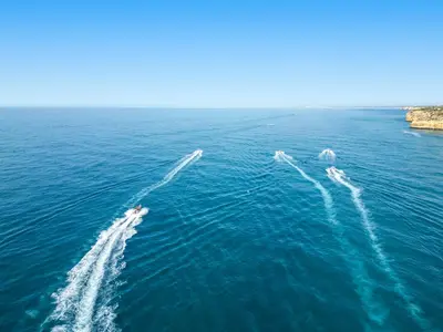 three boats in the water in the ocean at Villa Thai by Algarve Vacation in Albufeira