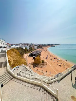 a view of a beach with people on the sand at Golden Palm Condo by BeCherish in Albufeira