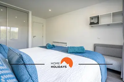 a bedroom with a bed with the words home huddles at #239 Vivenda V3 com Piscina by Home Holidays in Albufeira