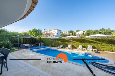 a villa with a swimming pool and a house at #239 Vivenda V3 com Piscina by Home Holidays in Albufeira