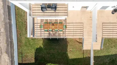 an overhead view of a house with a porch at Host Wise - Serene Spacious House - Swimming Pool & Garden in Olhos de Água