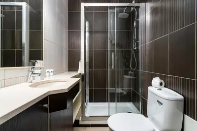 a bathroom with a shower and a toilet and a sink at Host Wise - Bright Lovely Flat - Balcony in Guia