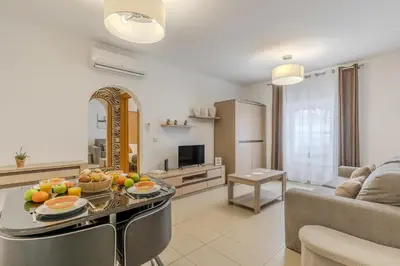 a bathroom with a sink and a shower and a mirror at #251 Coronel Águas by Home Holidays in Albufeira