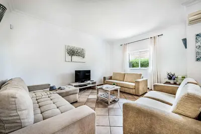 a living room with two couches and a tv at Villa Norcas Grande in Galé