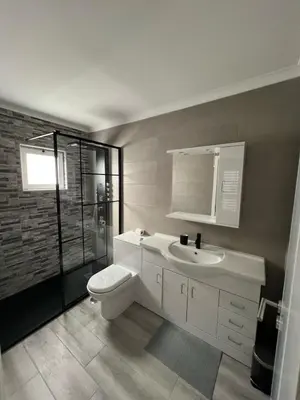 a bathroom with a toilet and a sink at Villa Feliz - Large Villa - Pool in Albufeira