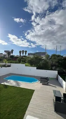 a bathroom with a toilet and a tub and a sink at Villa Feliz - Large Villa - Pool in Albufeira