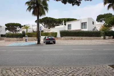 a car parked on the side of a street at Pear Tree Villa in Vale do Lobo