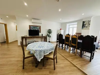 a dining room with a table and chairs at Castle House Loulé City Center in Loulé